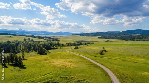 Scenic rural landscape with winding road and clouds