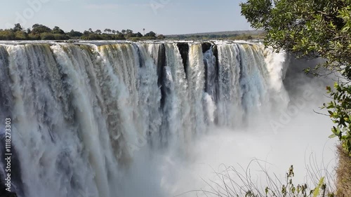 Famous Falls At Victoria Falls In Matabeleland North Zimbabwe. Giant Waterfalls. Nature Landscape. Victoria Falls At Matabeleland North Zimbabwe. Zambezi River. Travel Scenery. photo