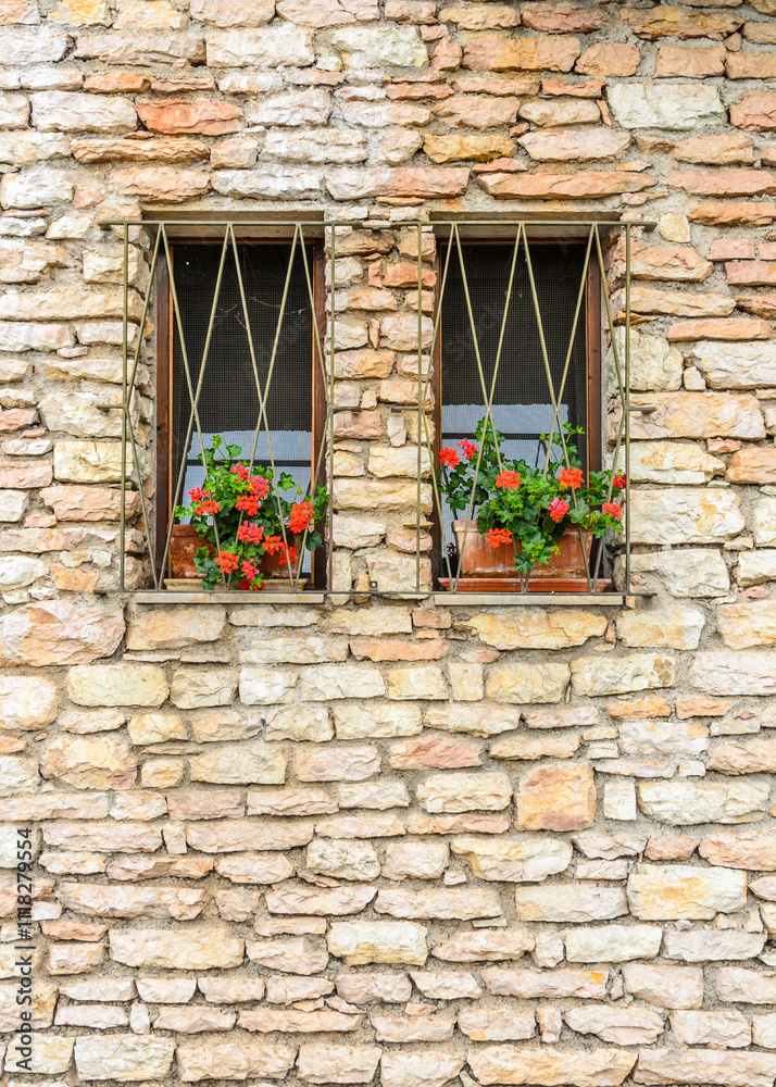 Beautiful window decorated with flowers in italy Beautiful window decorated with flowers in italy