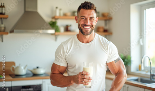 A male athlete drinks smoothies in the kitchen