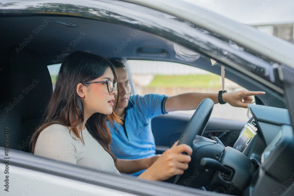 A student driver eager to learn gets guidance and instruction from a qualified instructor A student driver eager to learn gets guidance and instruction from a qualified instructor