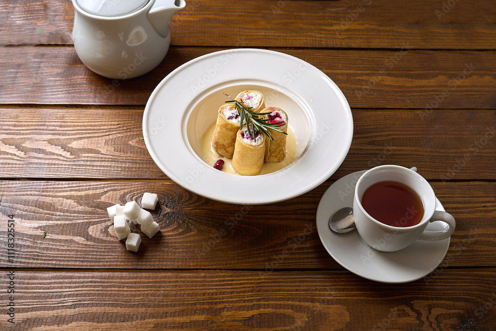 Rolled Pancakes with Sweet Filling and Tea