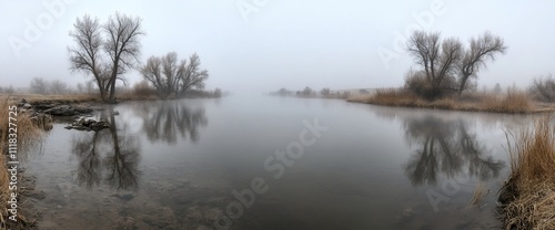 Misty river landscape with reflections.