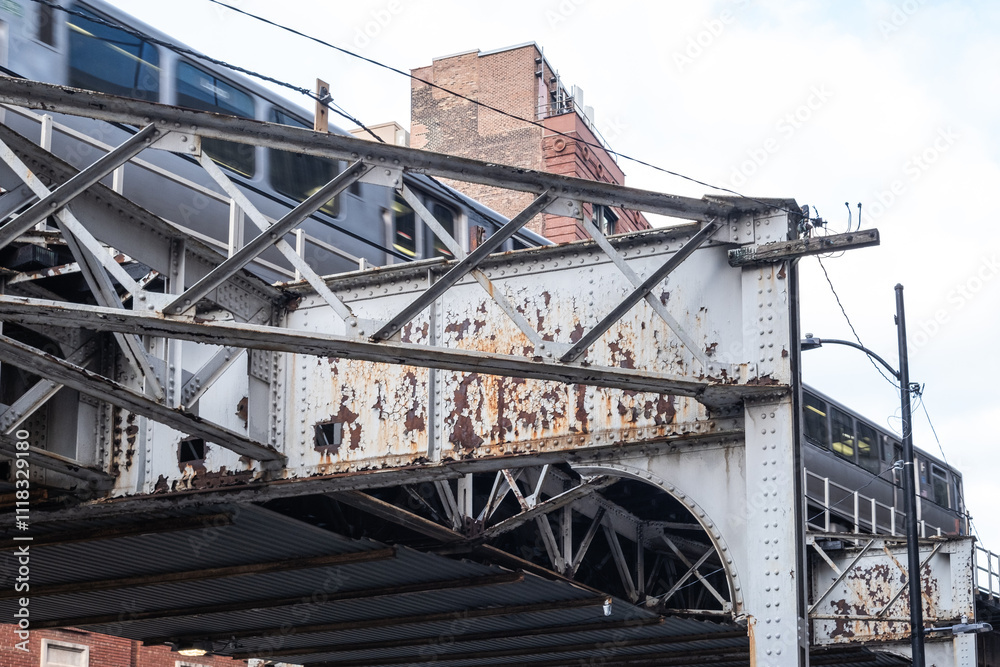 Fototapeta premium the elevated train system in Chicago, structure with a train travelling by