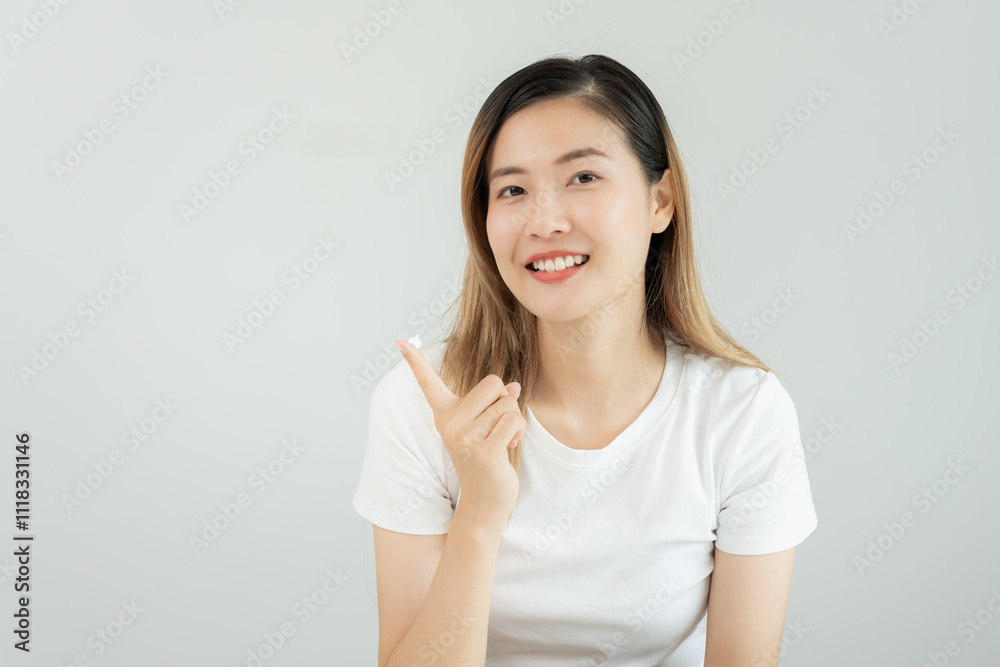 Beautiful Asian woman smile use cream for good skin. face of a healthy woman apply cream and makeup. Advertisement for skin cream, anti-wrinkle, baby face, whitening, moisturizer, tighten pores serum. Beautiful Asian woman smile use cream for good skin. face of a healthy woman apply cream and makeup. Advertisement for skin cream, anti-wrinkle, baby face, whitening, moisturizer, tighten pores serum.