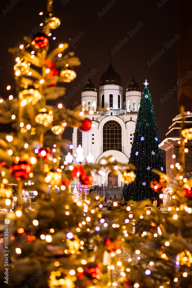 Fototapeta premium New Year tree on the central square in kaliningrad near the church.
