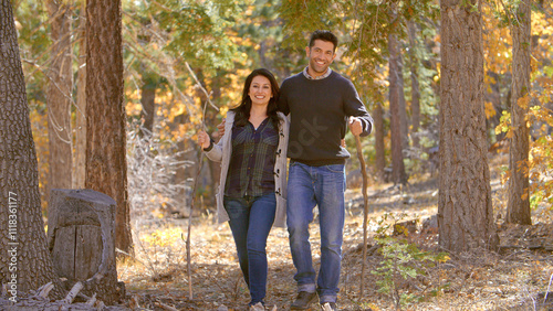 Active Mature Loving Couple Outdoors Enjoying Autumn Or Fall Walk In Forest