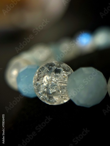 bracelet made of expensive natural stone with silver inserts and a pendant with runes