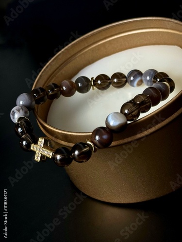 bracelet made of expensive natural stone with silver inserts and a pendant with runes