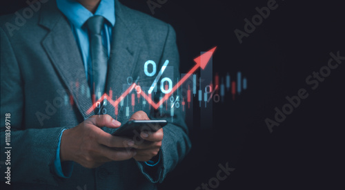 Interest rates and inflation, Debt rates, Finance concept, Businessman holding phone showing financial percentage and red graph. Central bank interest rate calculation increasing with economic growth