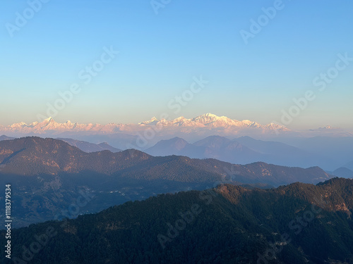 A beautiful view of Garhwal mountain range during the sunset from the outskirts of Chopta, Uttarakhand photo