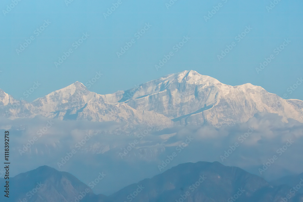 Fototapeta premium A beautiful view of Garhwal mountain range during the sunset from the outskirts of Chopta, Uttarakhand