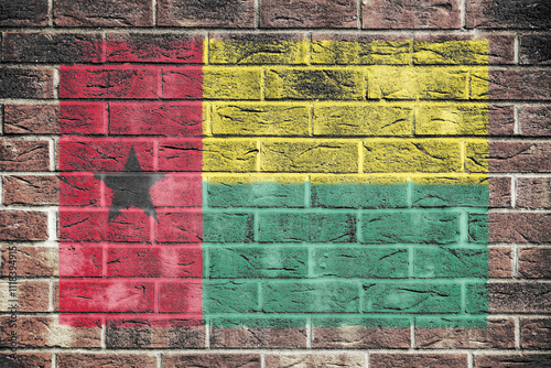 Guinea-Bissau flag on brick wall background photo