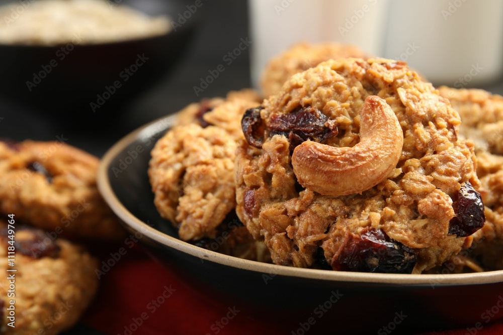 Delicious oatmeal cookies with raisins and nuts on table, closeup Delicious oatmeal cookies with raisins and nuts on table, closeup