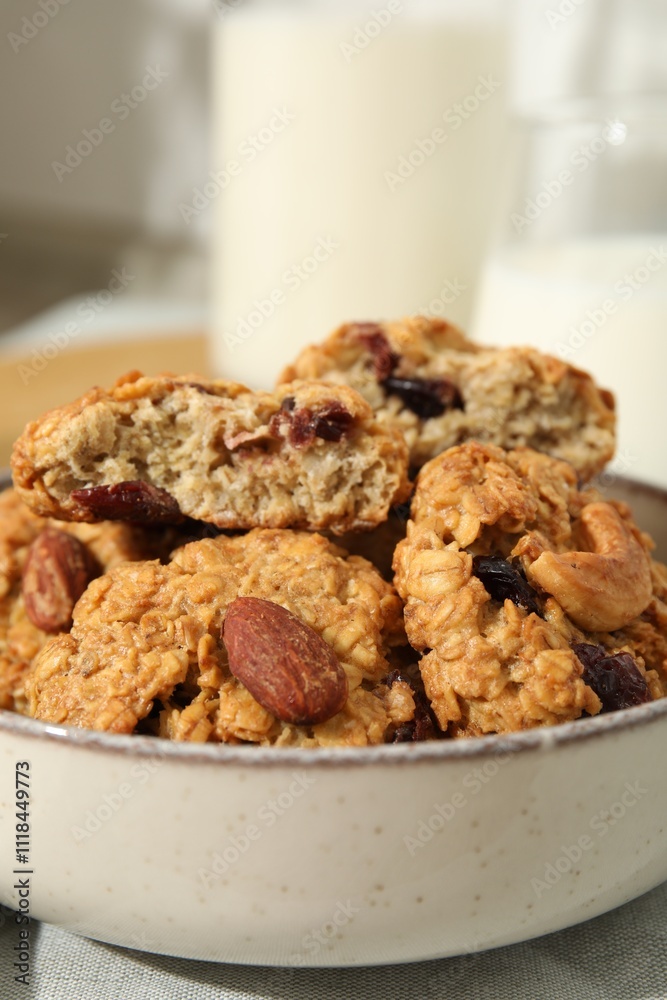 Delicious oatmeal cookies with raisins and nuts on table, closeup Delicious oatmeal cookies with raisins and nuts on table, closeup