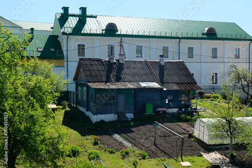 old wooden house with a greenhouse in the yard, Polotsk photo