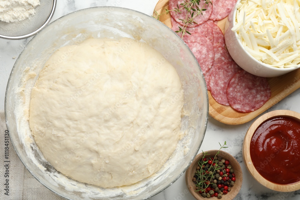 Making calzone pizza. Different ingredients on white marble table, flat lay Making calzone pizza. Different ingredients on white marble table, flat lay