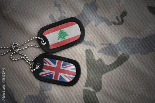 army blank, dog tag with national flag of lebanon and great britain on the khaki texture background. military concept. photo