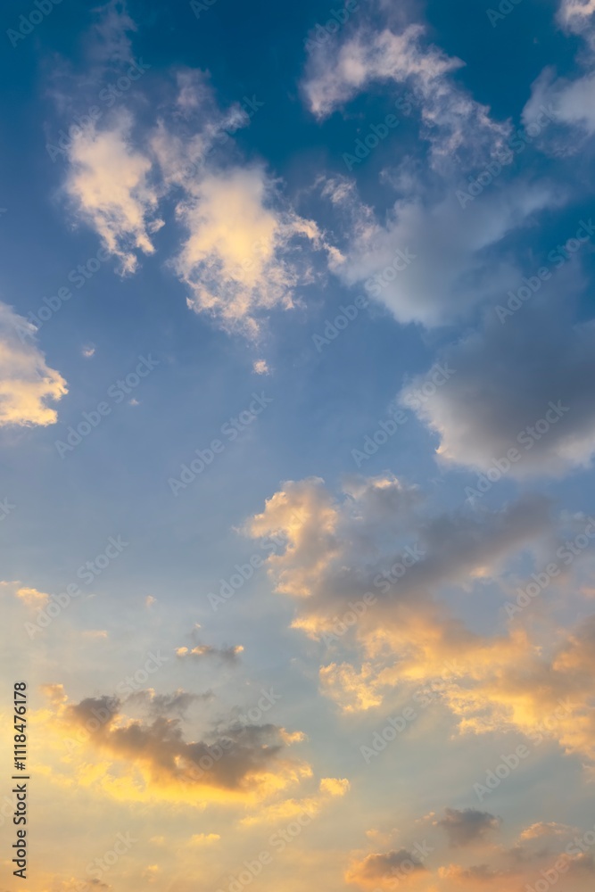 A bright sky at sunrise or sunset, with soft gradients of blue mixed with gold and orange, as clouds spread out, some illuminated by sunlight. A bright sky at sunrise or sunset, with soft gradients of blue mixed with gold and orange, as clouds spread out, some illuminated by sunlight.