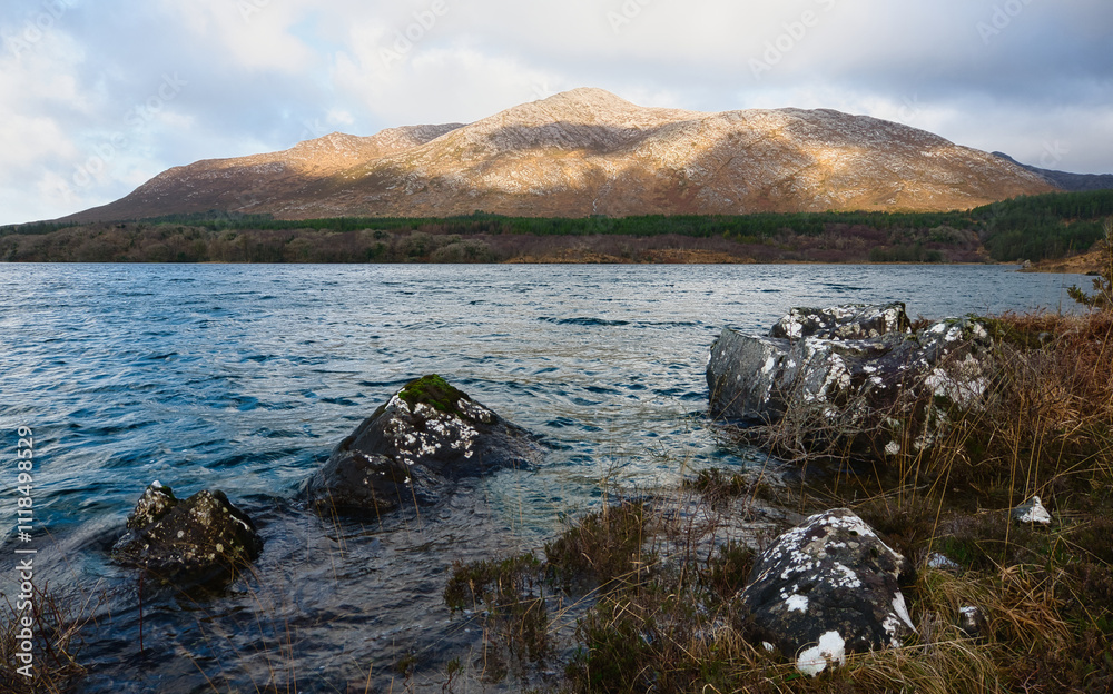 Beautiful landscape scenery with lake and mountains at Derryclare natural reserve in Connemara National park, county Galway, Ireland, nature background