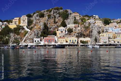 boats in the picturesque and beautiful waters of Symi island marina photo