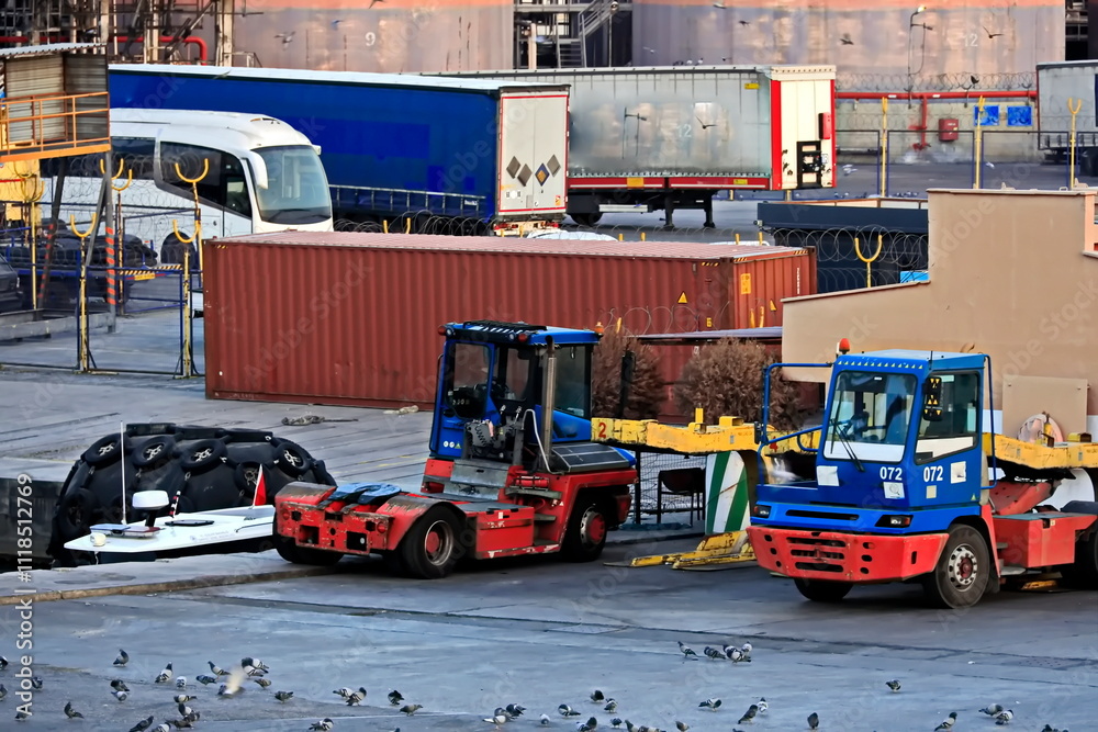 Fototapeta premium Various types of vessels calling at the port and moored at the berth. Tugs in the port. Mersin, Turkey, 2024