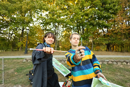 two young and innovative female artists conducting an outdoor painting lesson