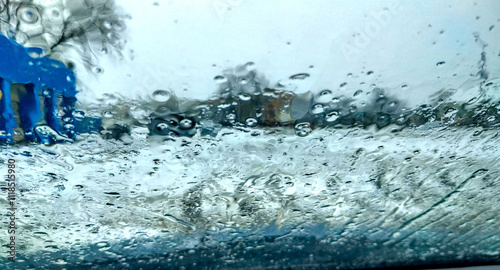 Obraz na płótnie Photo of raindrops on car glass w salonie