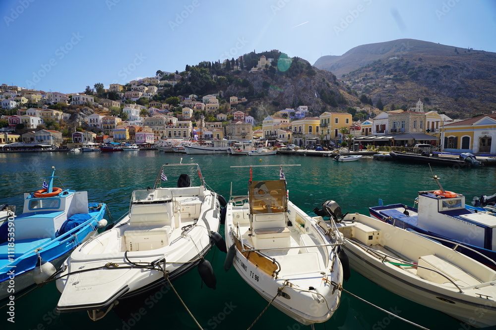 Obraz premium boats in the picturesque and beautiful waters of Symi island marina