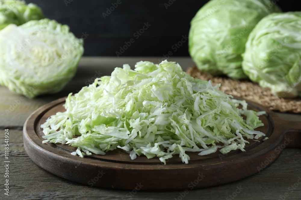Fresh shredded cabbage on wooden table, closeup Fresh shredded cabbage on wooden table, closeup