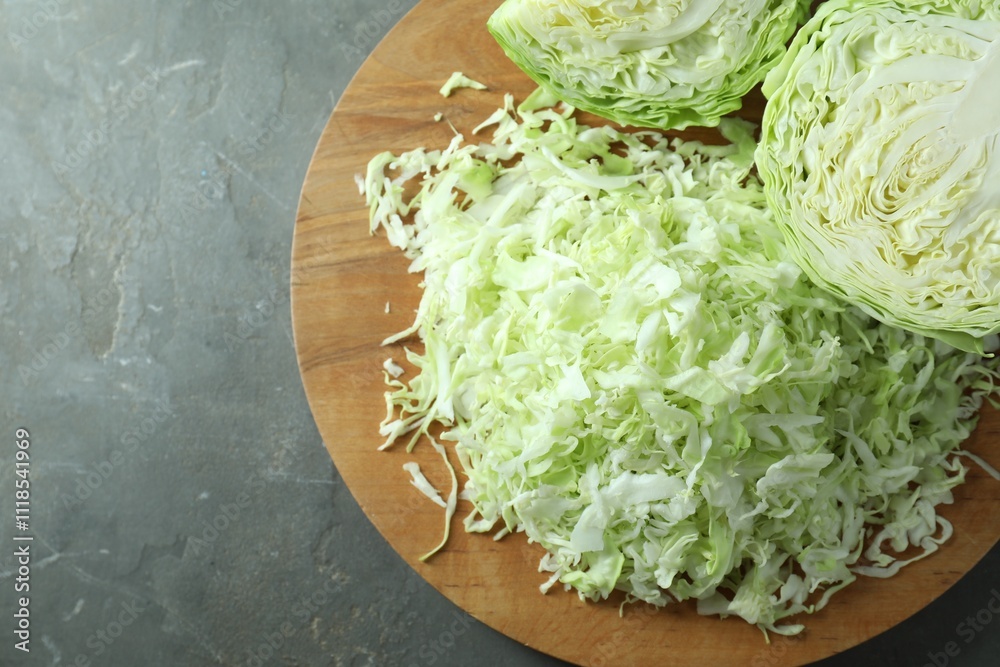 Fresh shredded cabbage on grey table, top view. Space for text Fresh shredded cabbage on grey table, top view. Space for text