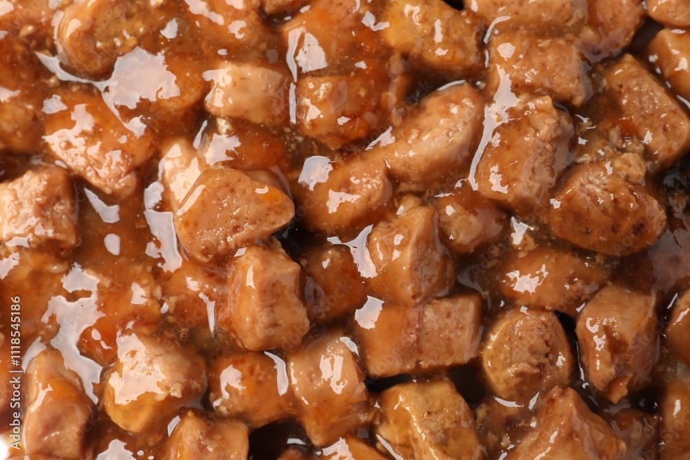 Pieces of wet pet food as background, top view Pieces of wet pet food as background, top view