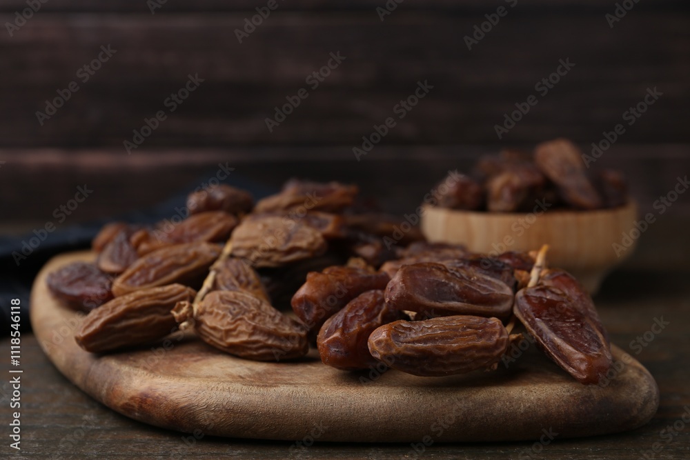 Fototapeta premium Tasty dried dates on wooden table, closeup