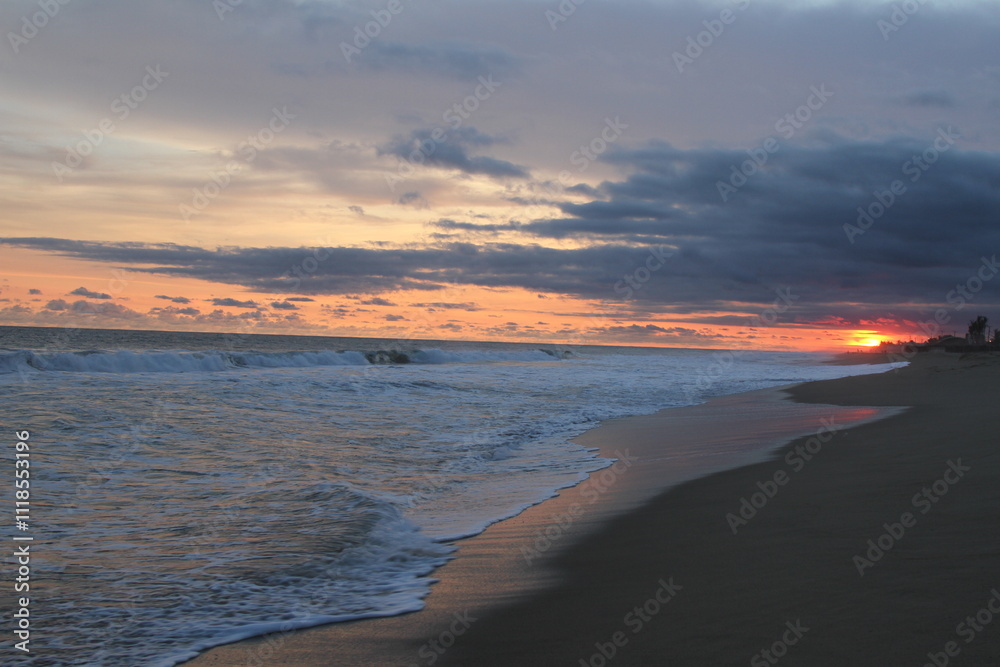 Beautiful sunset on the beach, a cloudy sky with orange tones. Beautiful sunset on the beach, a cloudy sky with orange tones.