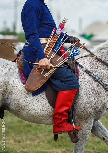 Turkish archer on horse wearing traditional ethnic costume at Etnospor Kultur Festivali. Istanbul - 11 May,2018 photo