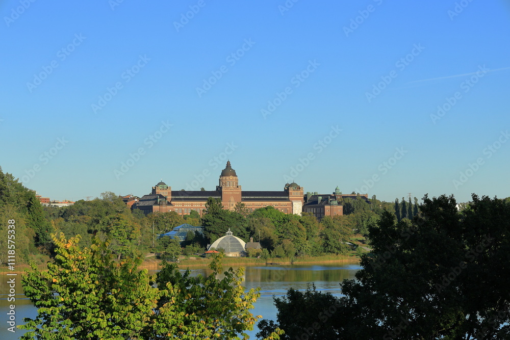 Naklejka premium Swedish nature in early autumn one sunny day. Swedish building called naturhistoriska riksmuseet. Translated in english to the National Museum of Natural History.