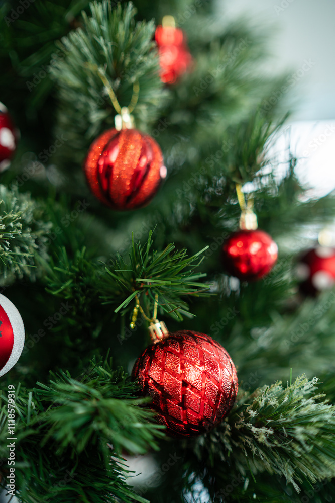 Merry x-mas,Close up of Colorful balls ,gifts box and Christmas greeting picture parcel,bell decoration on Green Christmas tree background Decoration During Christmas and New Year.