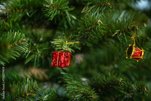 Obraz na płótnie Merry x-mas,Close up of Colorful balls ,gifts box and Christmas greeting picture parcel,bell decoration on Green Christmas tree background Decoration During Christmas and New Year. w salonie