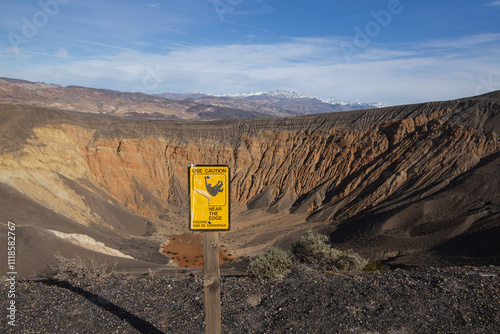 Warning sign at Ubehebe Crater Rim Trail at Death Valley National Park, California photo