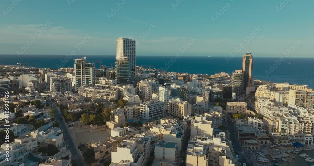 Panoramic Aerial View of St. Julians Malta with Modern City Skyline High-Rise Architecture and Scenic Streets along the Mediterranean Coastline. High quality 4k footage Panoramic Aerial View of St. Julians Malta with Modern City Skyline High-Rise Architecture and Scenic Streets along the Mediterranean Coastline. High quality 4k footage