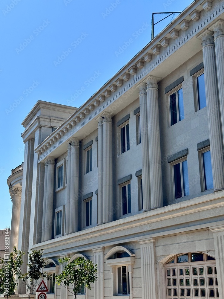 view of the facade of an old building in Durres with architectural columns on a sunny summer day
view of the facade of an old building in Durres with architectural columns on a sunny summer day