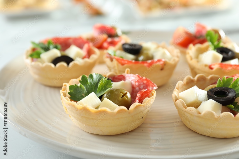 Many tasty canapes on white table, closeup Many tasty canapes on white table, closeup