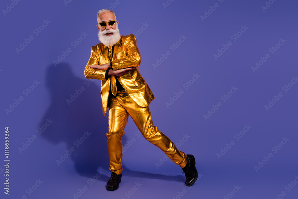 Full body photo of bearded gentleman have fun dancing wear fashionable golden clothes isolated on violet color background Full body photo of bearded gentleman have fun dancing wear fashionable golden clothes isolated on violet color background