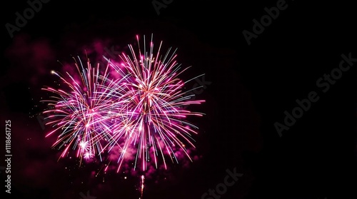 Vibrant display of pink and purple fireworks against a dark night sky, capturing the beauty and excitement of a fireworks show