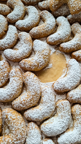 Christmas bakery. Top view of classic Vanilla Kipferl, traditional small Christmas cookies in the form of a crescent moon photo