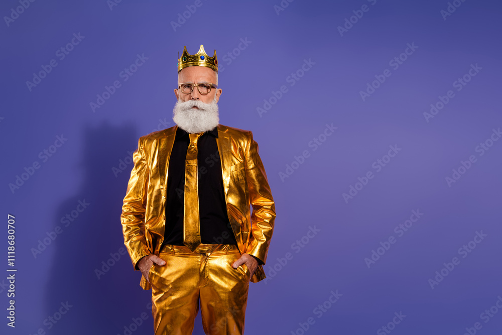 Portrait of funny eccentric aged man posing empty space wear golden shiny suit isolated on purple color background Portrait of funny eccentric aged man posing empty space wear golden shiny suit isolated on purple color background