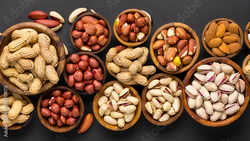 Healthy mix nuts and dried fruits on wooden background.