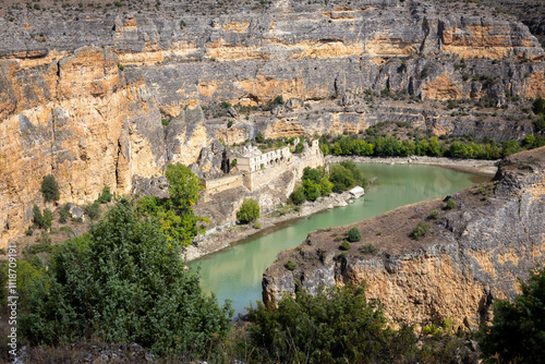 Hoces del Rio Duraton Nature Reserve landscape with the convent of Nuestra Senora de los Angeles de la Hoz del Rio Duraton (Monastery of Our Lady of the Angels of the Hoz) ruins, Spain.