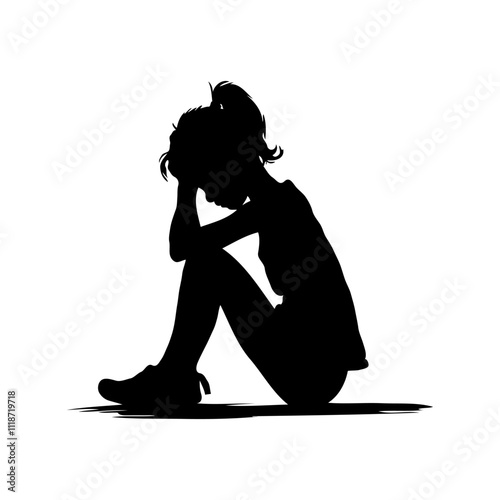 Silhouette of a child sitting with head down in sadness.