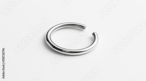 A sleek, minimalist silver ring with an open design, emphasizing modern jewelry aesthetics.